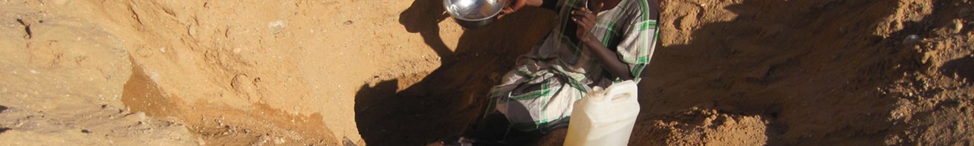 Somalilander Digging For Water In A Wadi